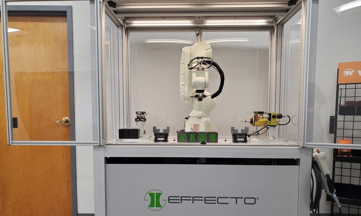 Robotic arm with Effecto End of Arm Tools around it. Tool changer, deburring tool, and gripper