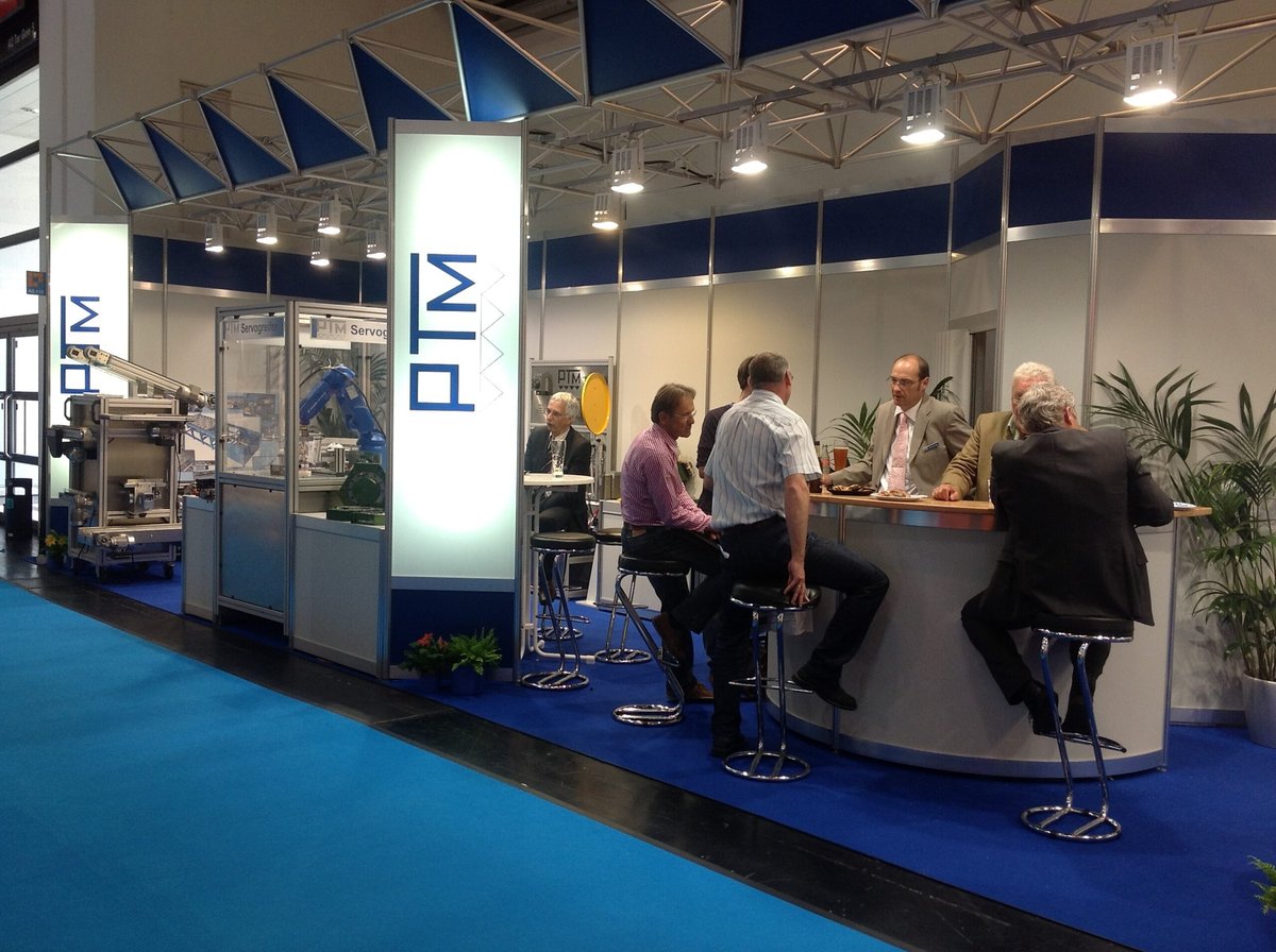 Photo of the PTM team at a trade show